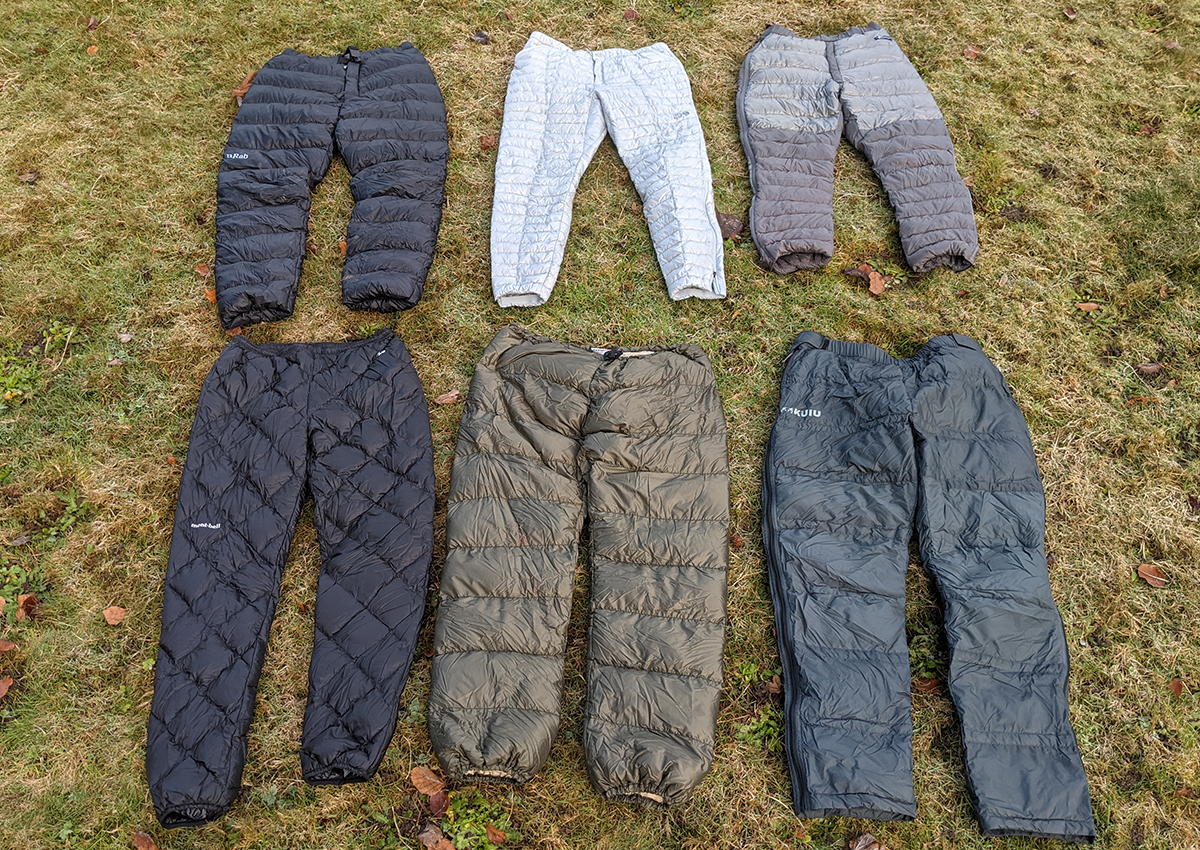 The best puffer pants are laid out on the grass.