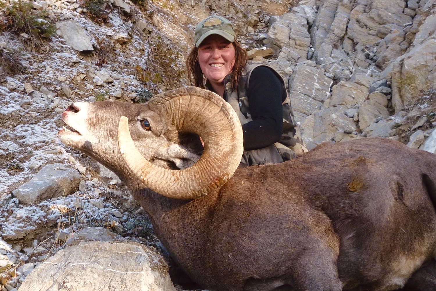 hunter with big horn sheep