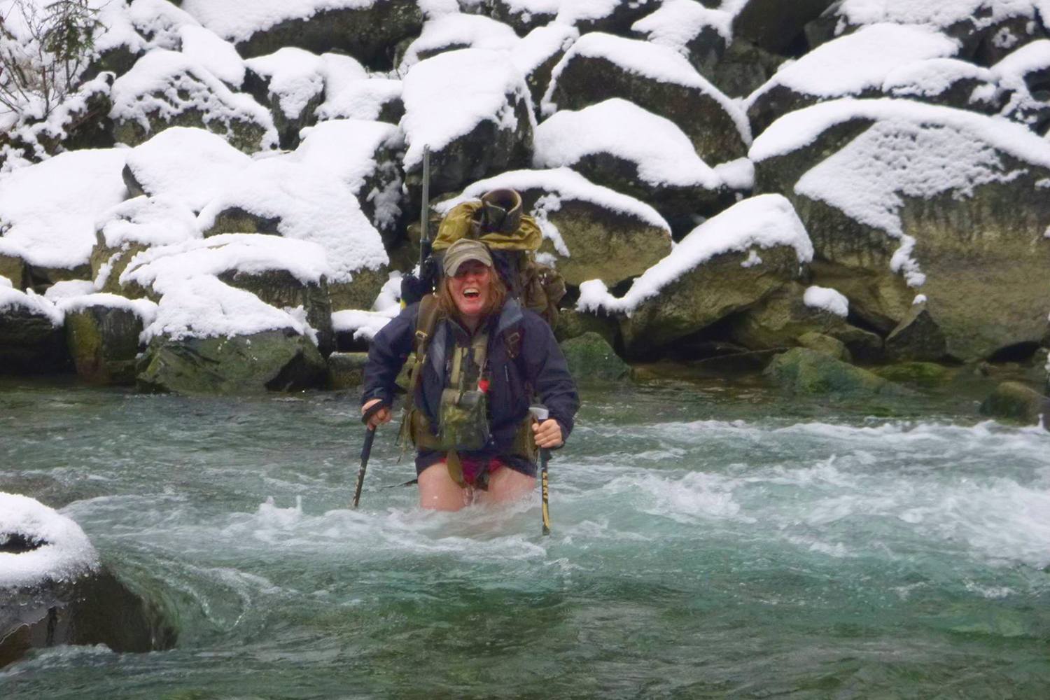 woman running through cold water