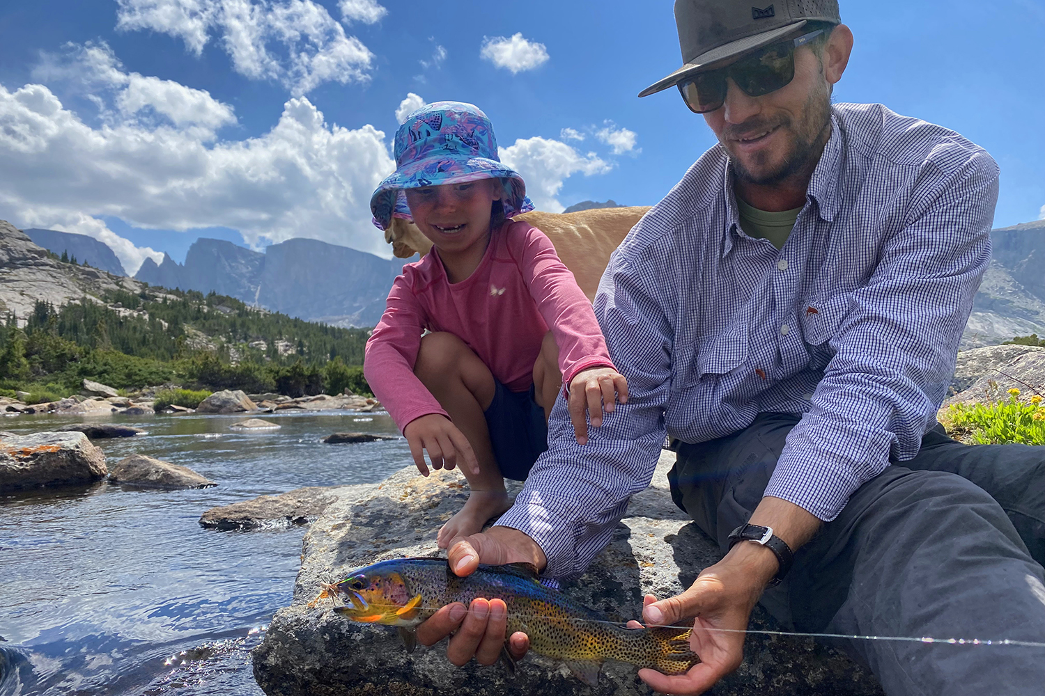 father, daughter catch trout