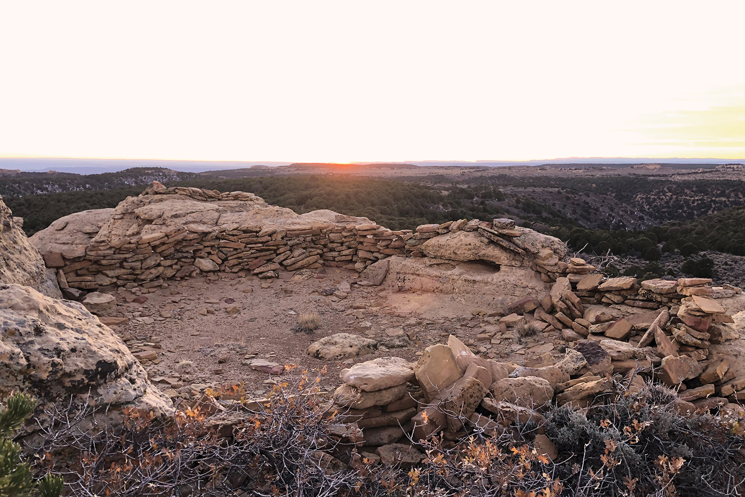 hoodoo-top structure and setting sun