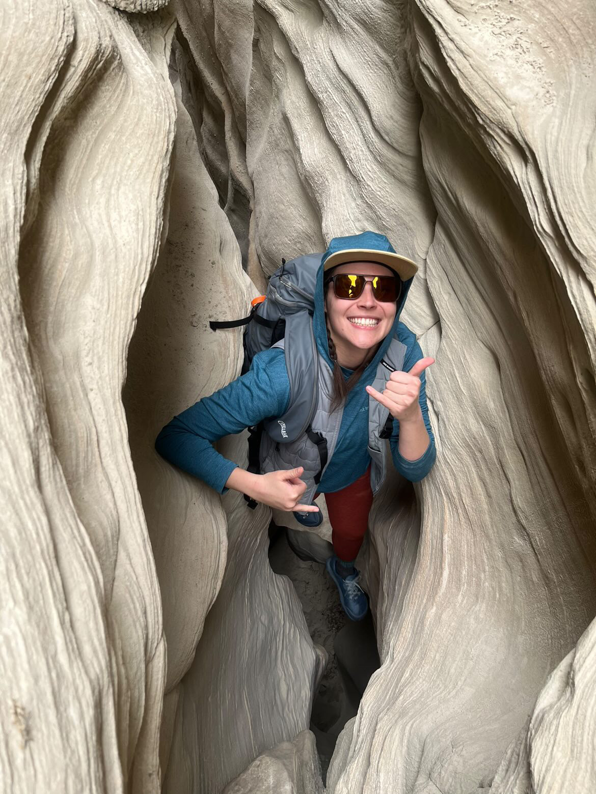 Author stands inside slot canyon with CamelBak SnoBlast.