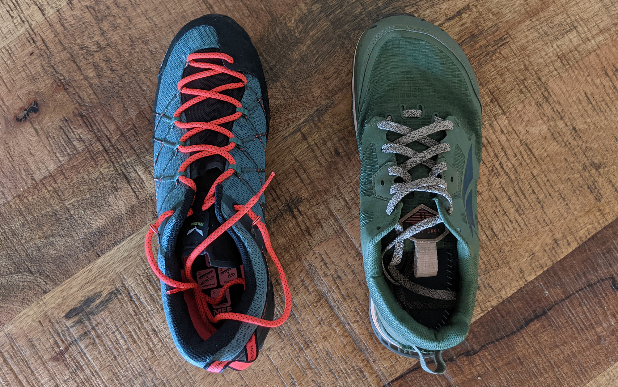 The Altra Lone Peak (right) next to Salewa Wildfire, an approach shoe with an unusually narrow toe box.