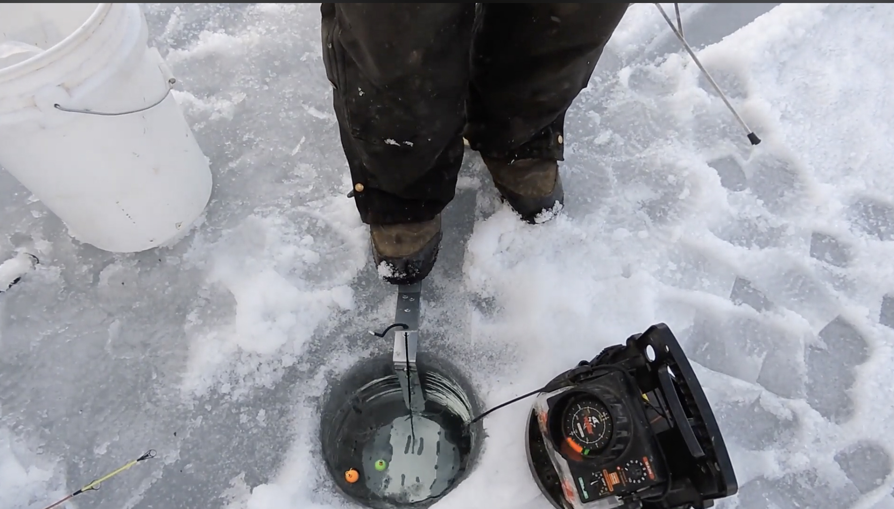 Grandpa Jimmy's Ice Hole Trap, deployed on the ice.