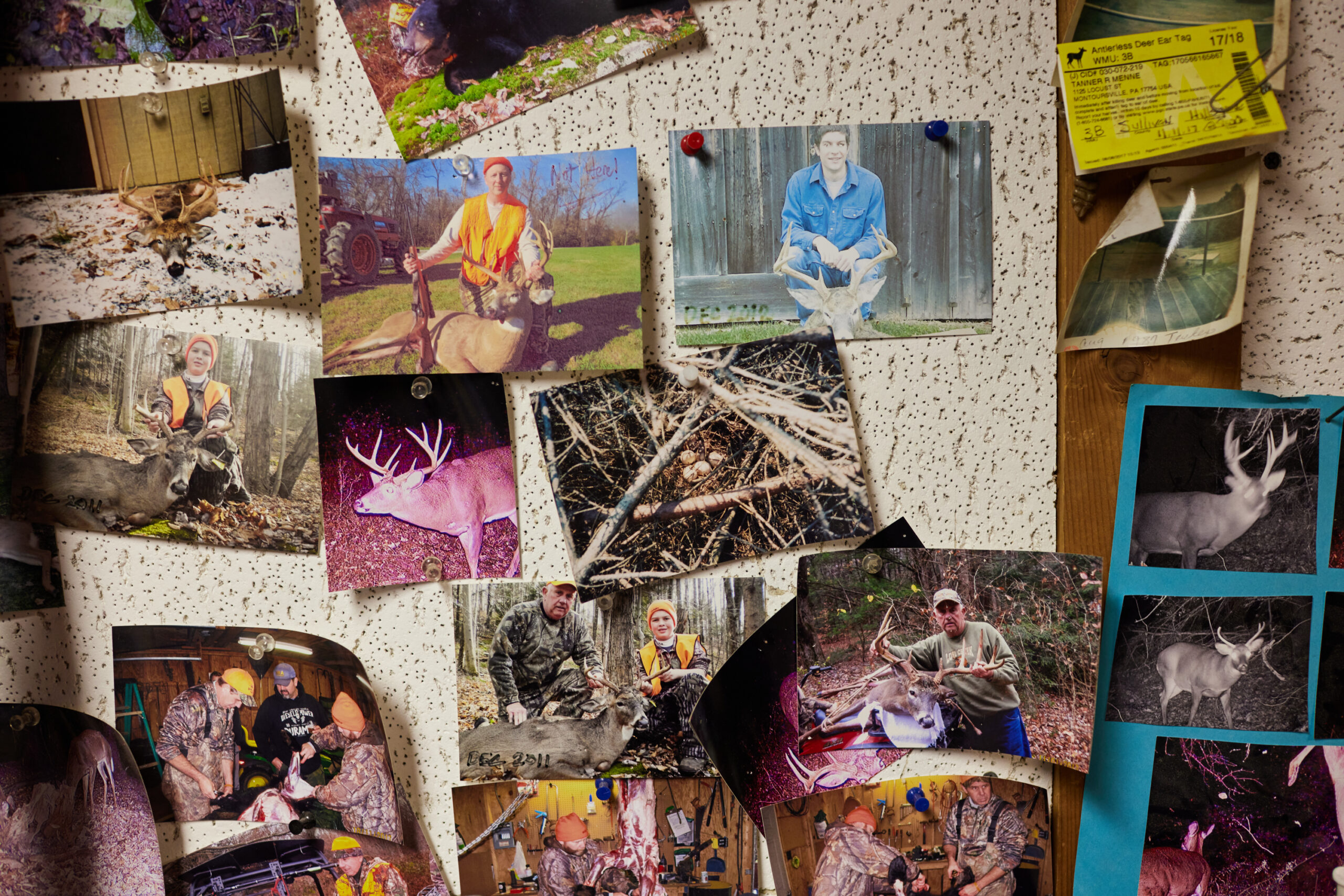 Photos of a bragging board at a deer camp.