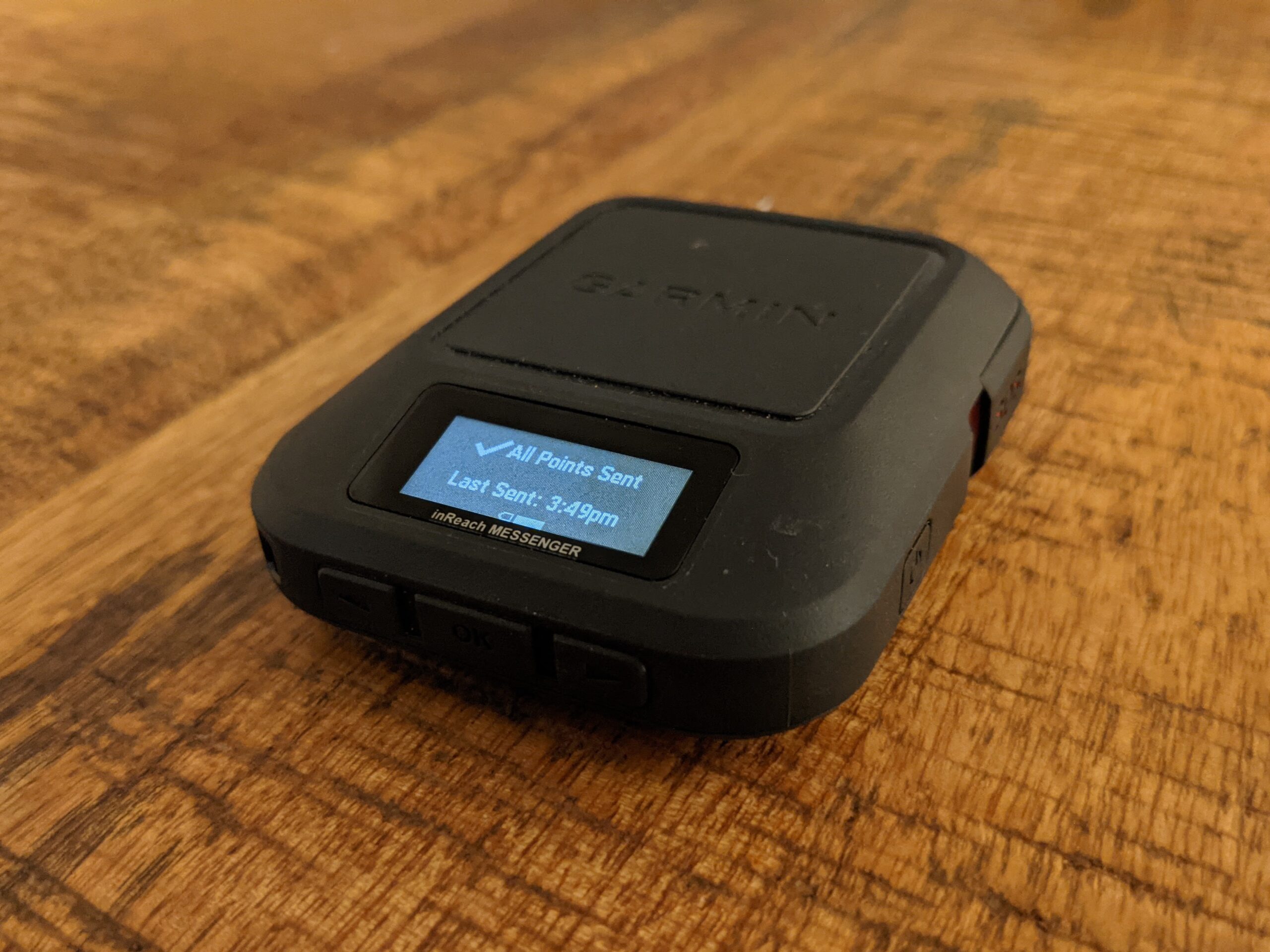 Three buttons on the bottom of the Garmin inReach Messenger provide plenty of functionality for toggling through the different menu options while a separate button on the side is used to send an SOS signal.