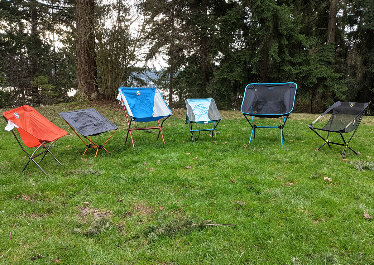The best backpacking chairs sit in the grass.