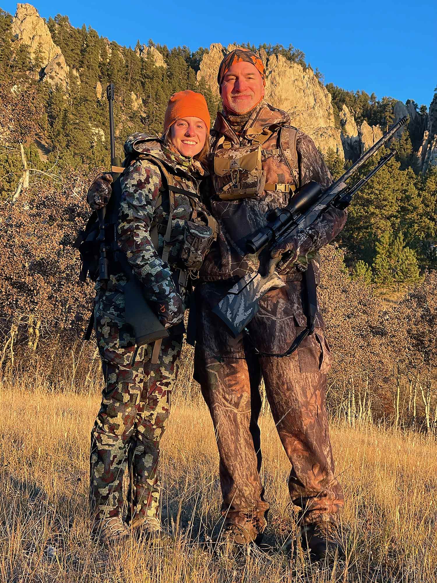 two hunters pose together, father and daughter