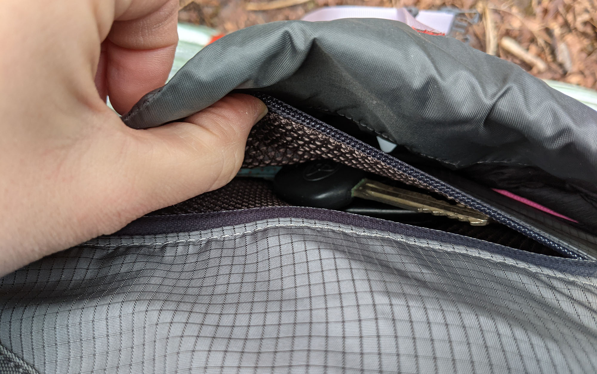 A zip pocket inside the front pocket is a useful spot to store any frontcountry valuables in the event you remove the brain of the pack 