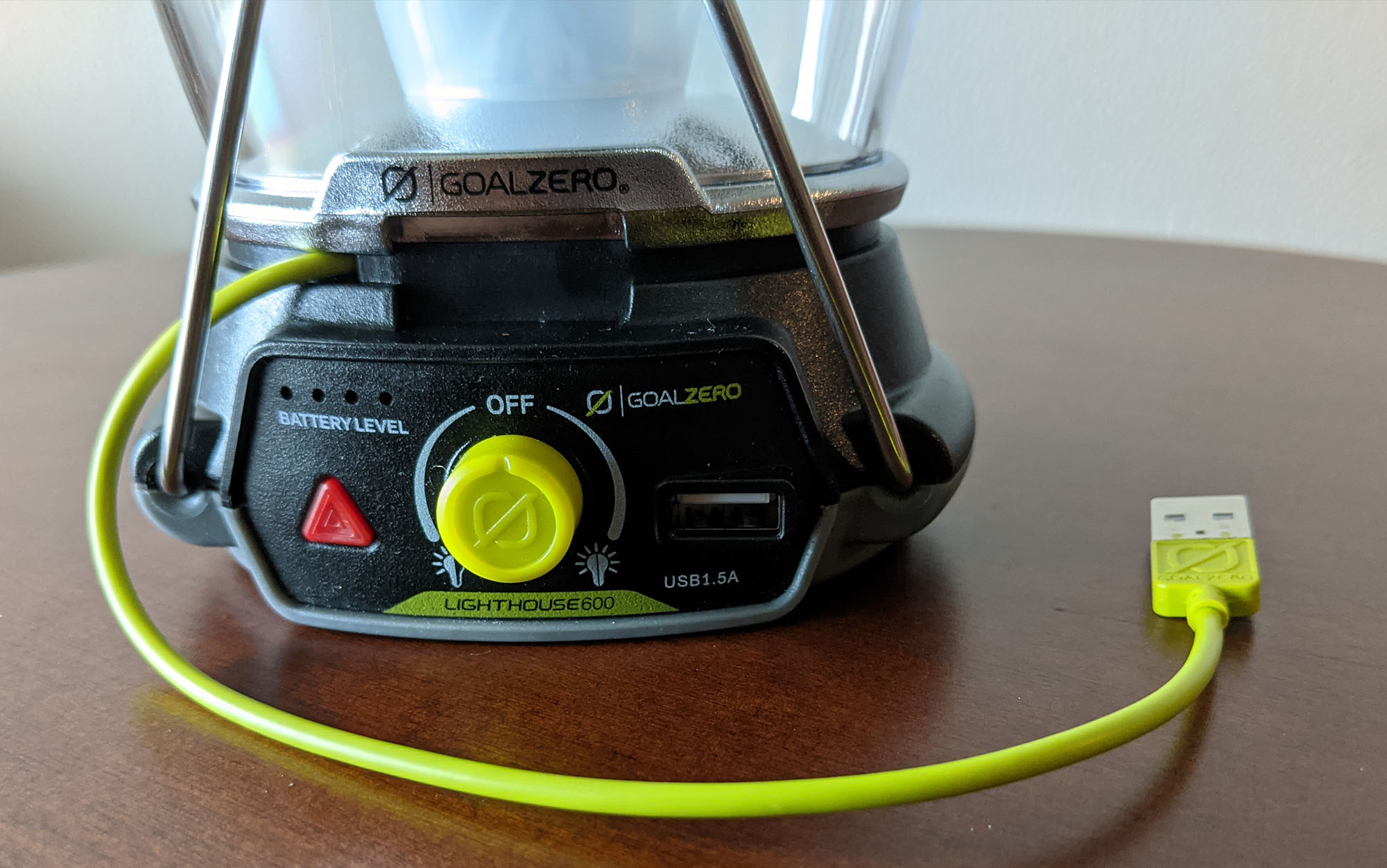 The Goal Zero has an attached USB charging cord.