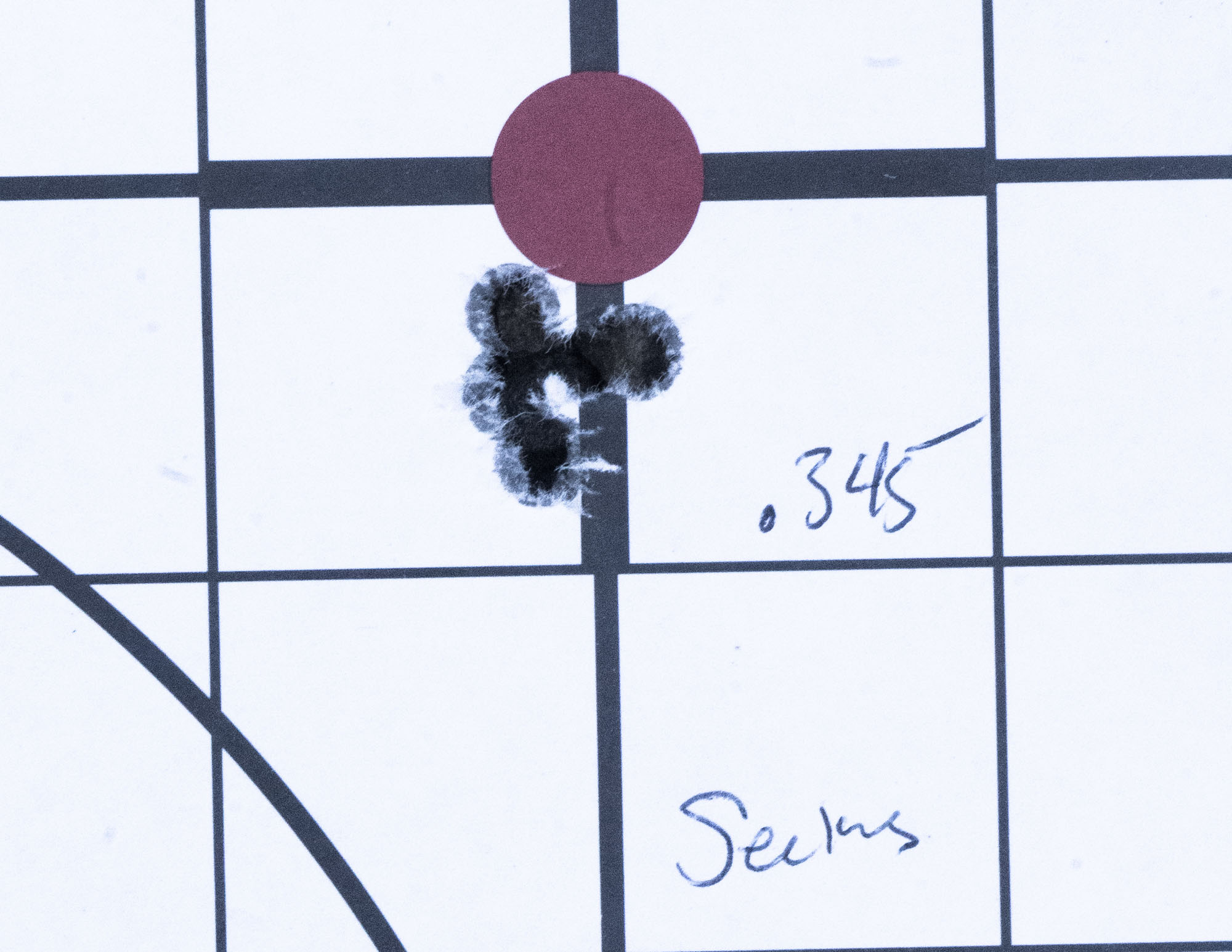 Target with small 5-shot rifle group