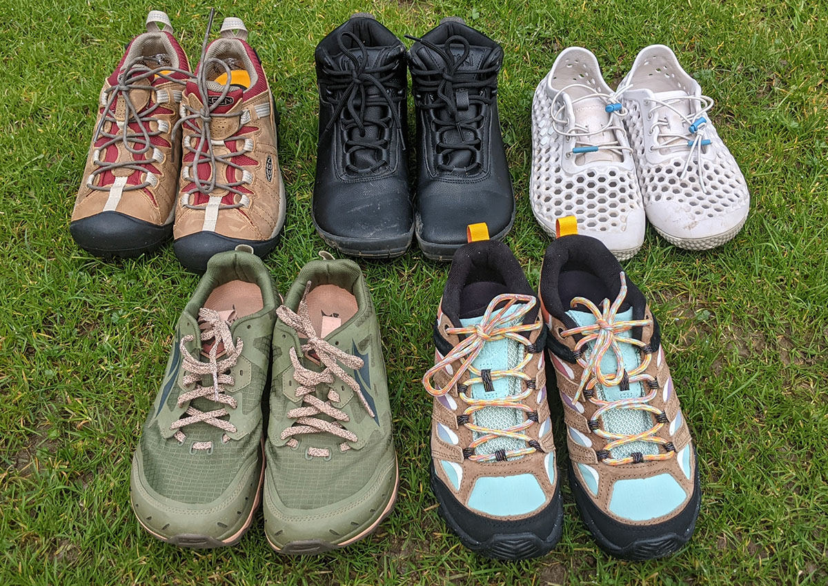 The best hiking shoes for wide feet sit in the grass.
