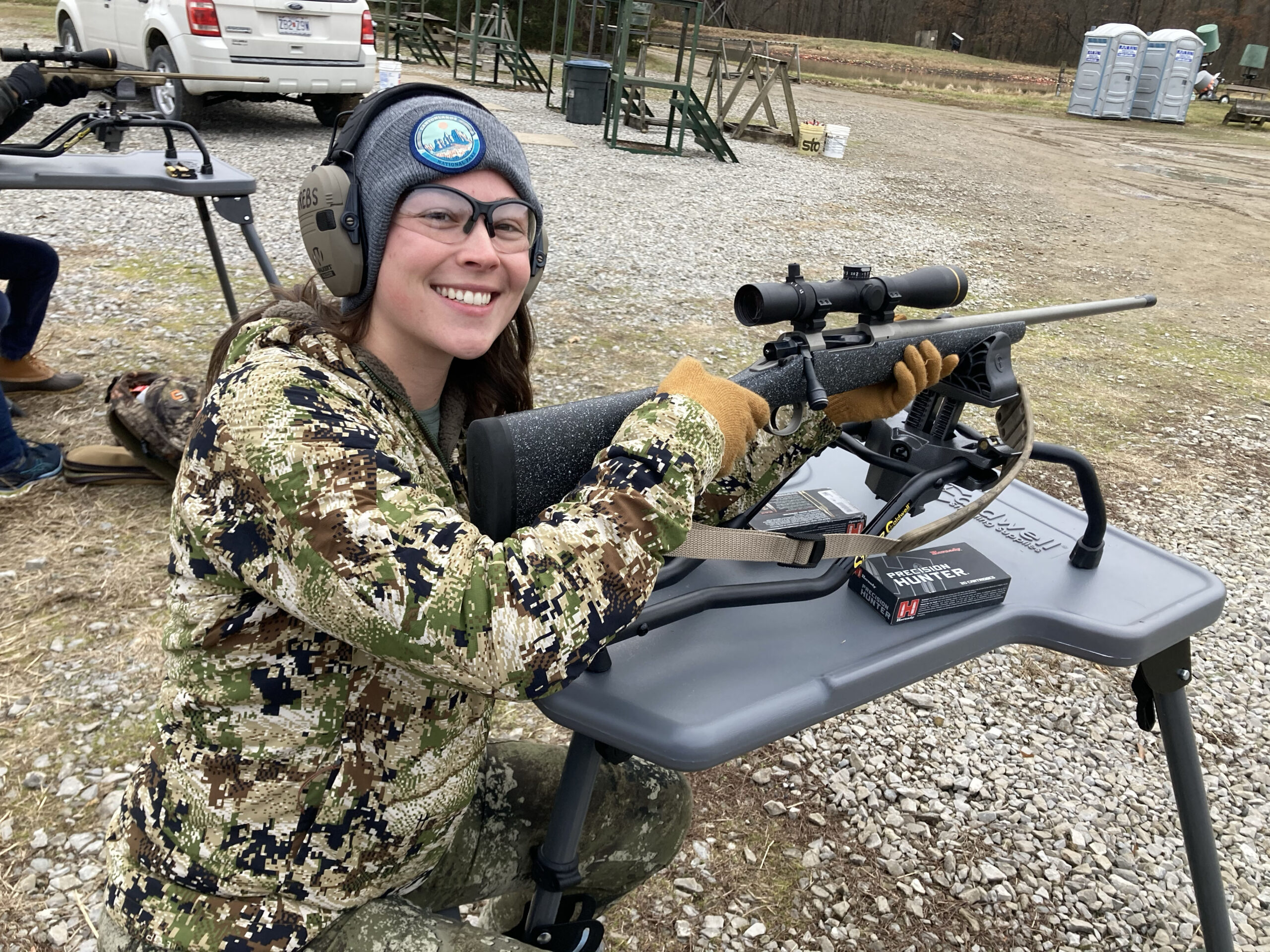 Author sights in her borrowed rifle at the range.