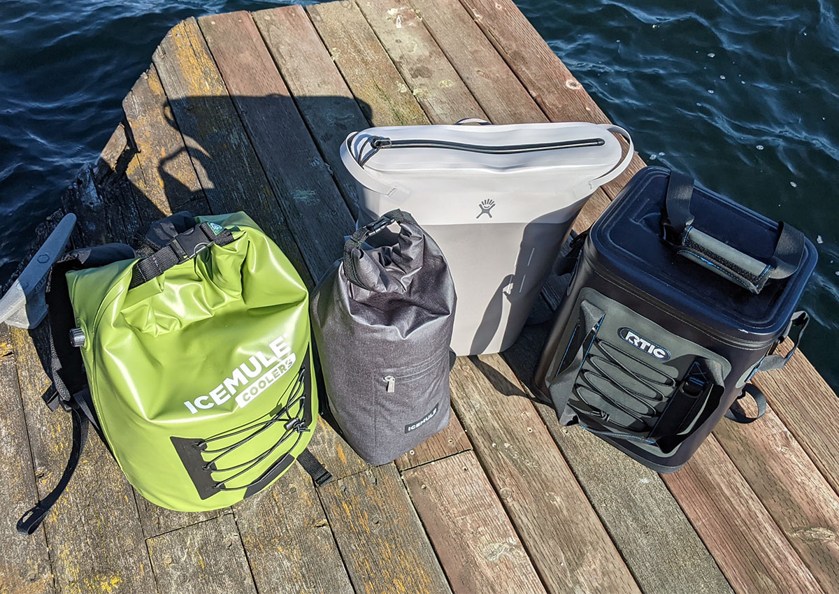 The best backpack coolers sit on a dock.