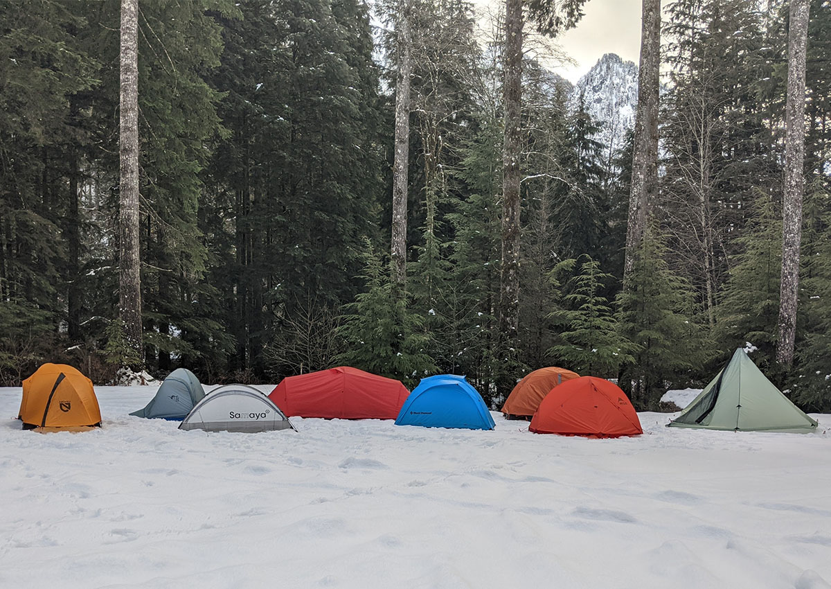 The best 4-season tents are set up in the snow.
