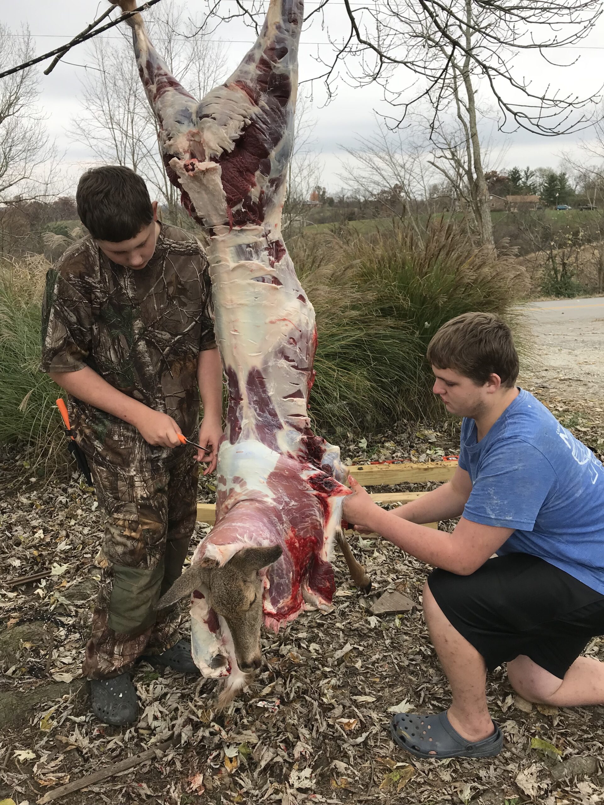 Michael Pendley's sons butchering venison
