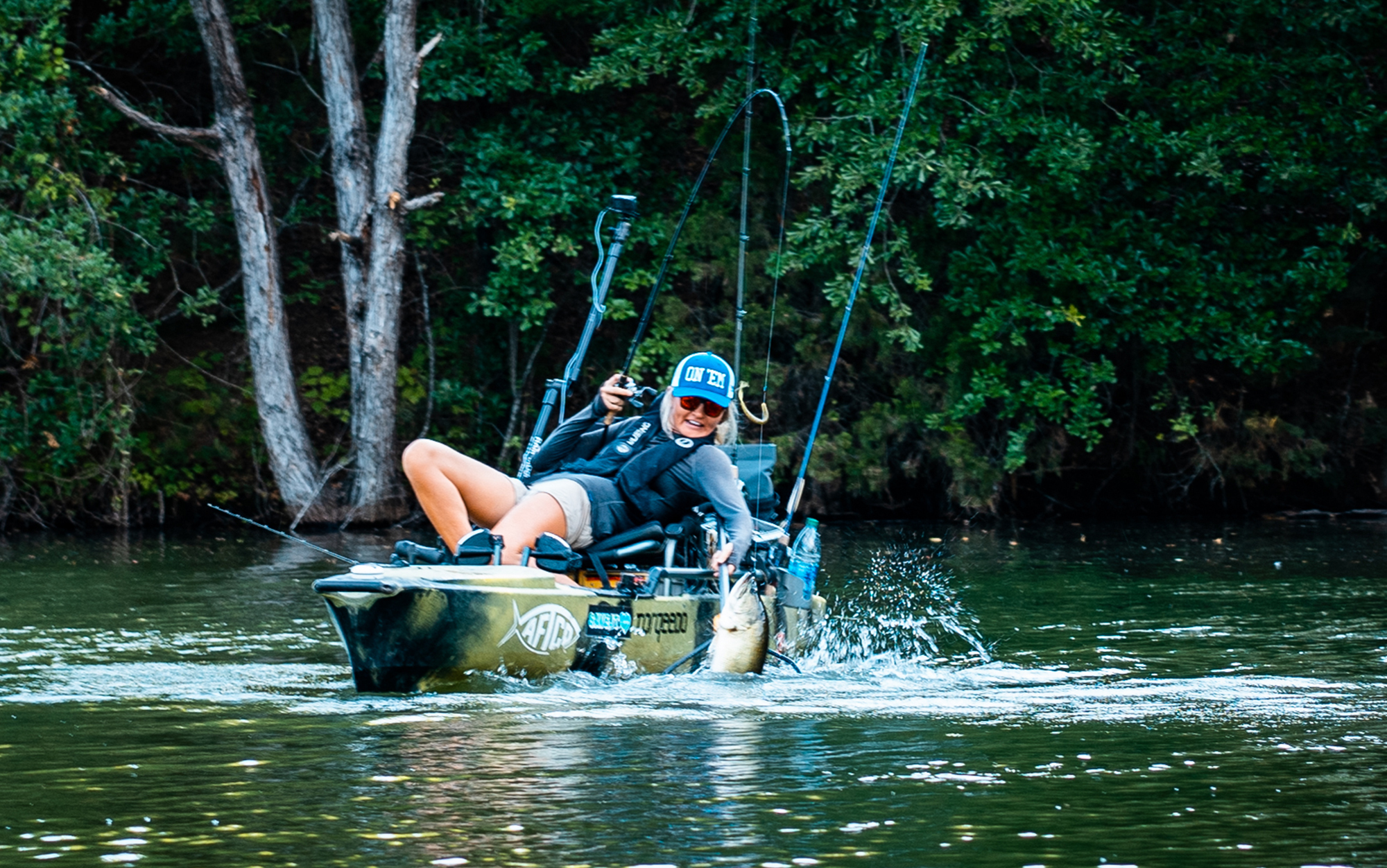 The author has caught many a fish from a kayak, and these are these are her favorite kayak fishing accessories.