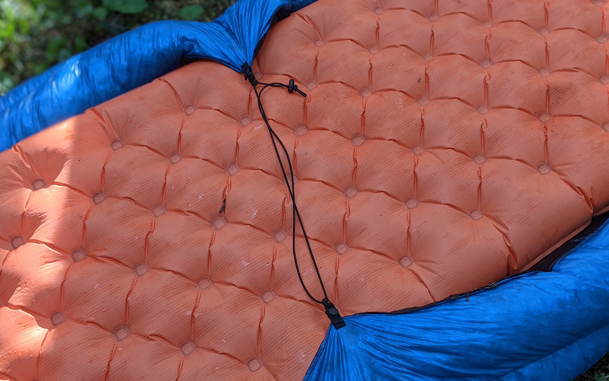 The single underpad strap of the Zpacks Solo Quilt was sufficient to keep out drafts for our experienced quilt users. 