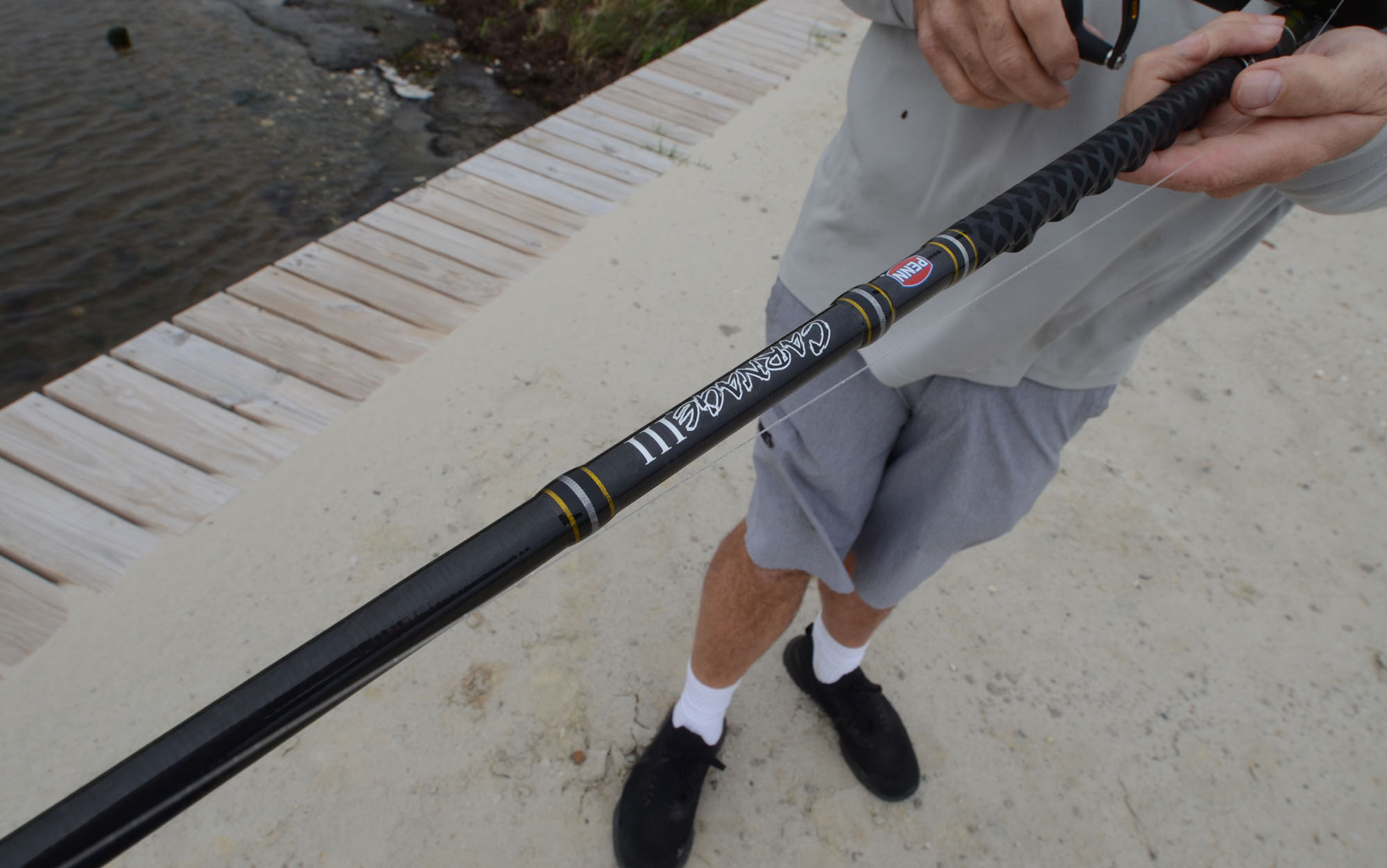 Angler holds one of the best surf fishing rods.