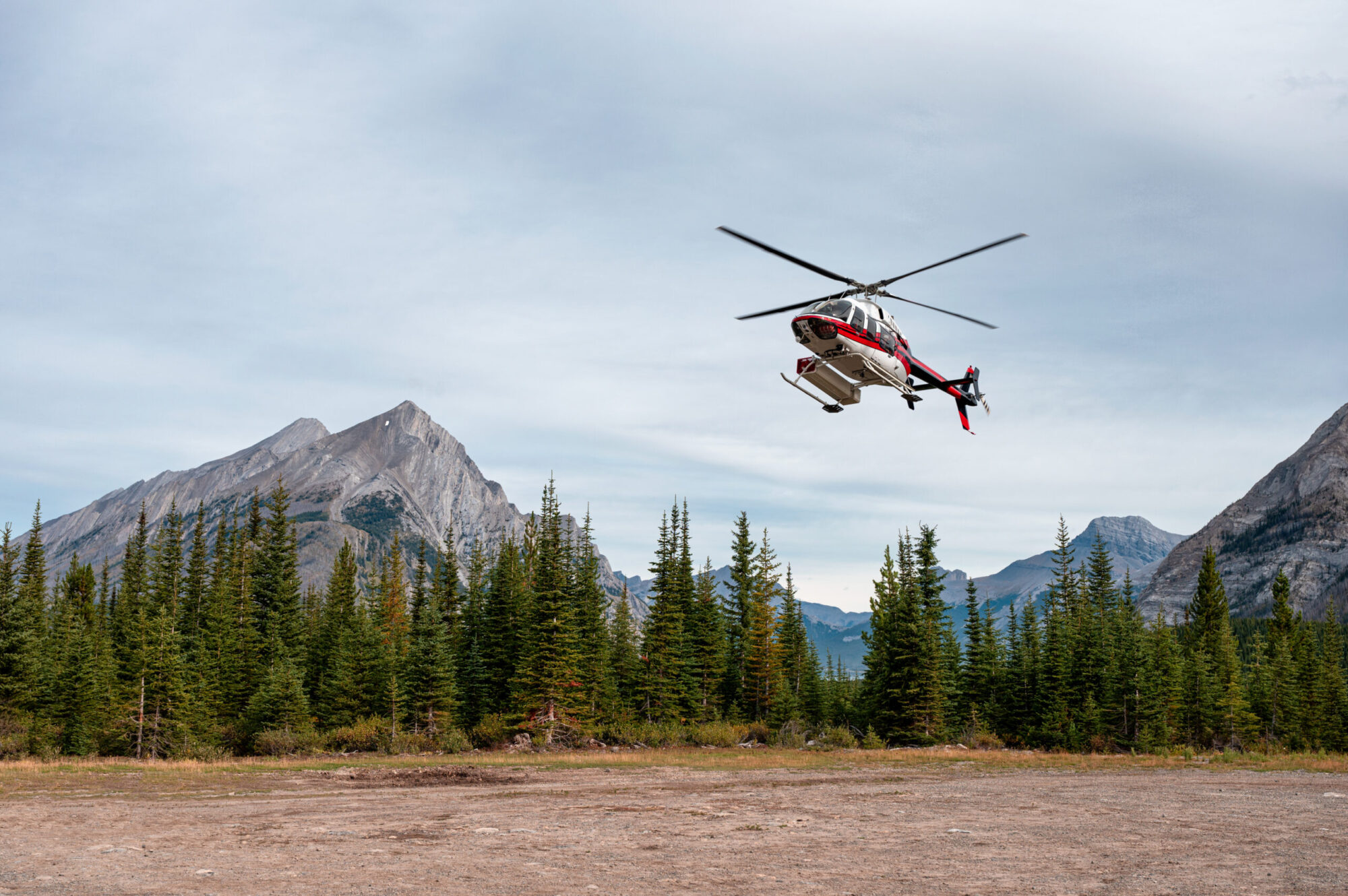 helicopter landing in mountains
