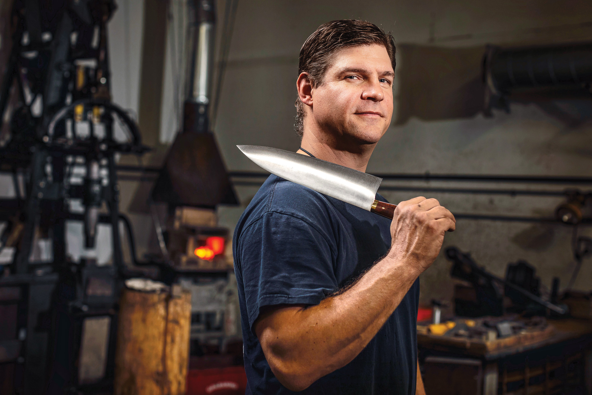 Knifemaker Murray Carter with a chef's knife.