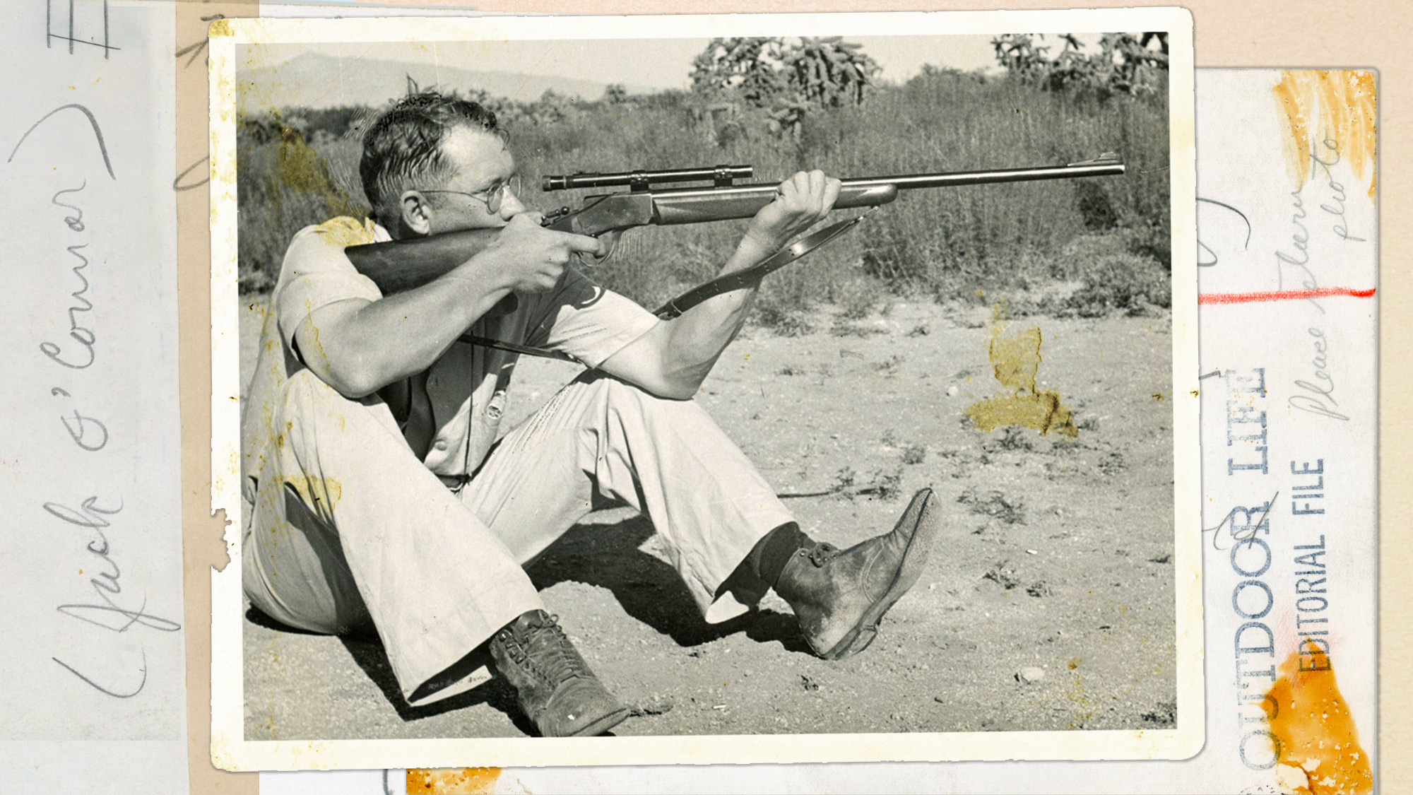 jack o'connor sits and holds rifle