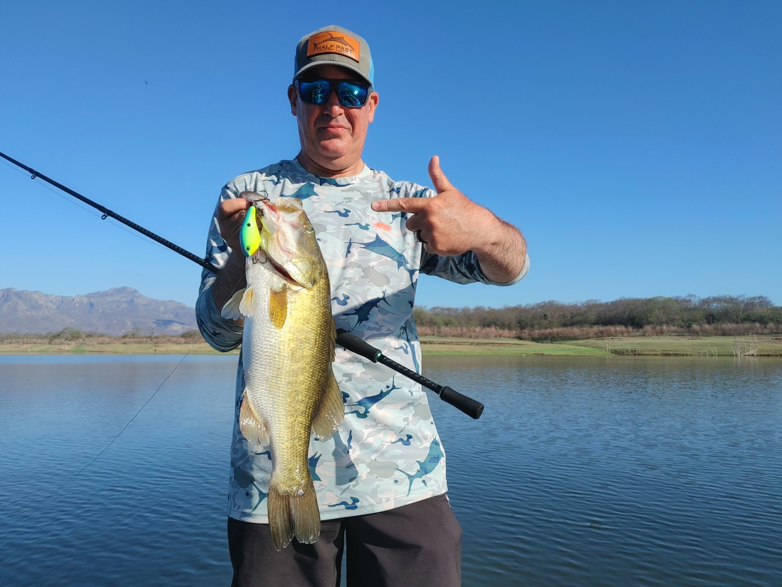 The author with a fish caught on a crankbait and a baitcasting reel