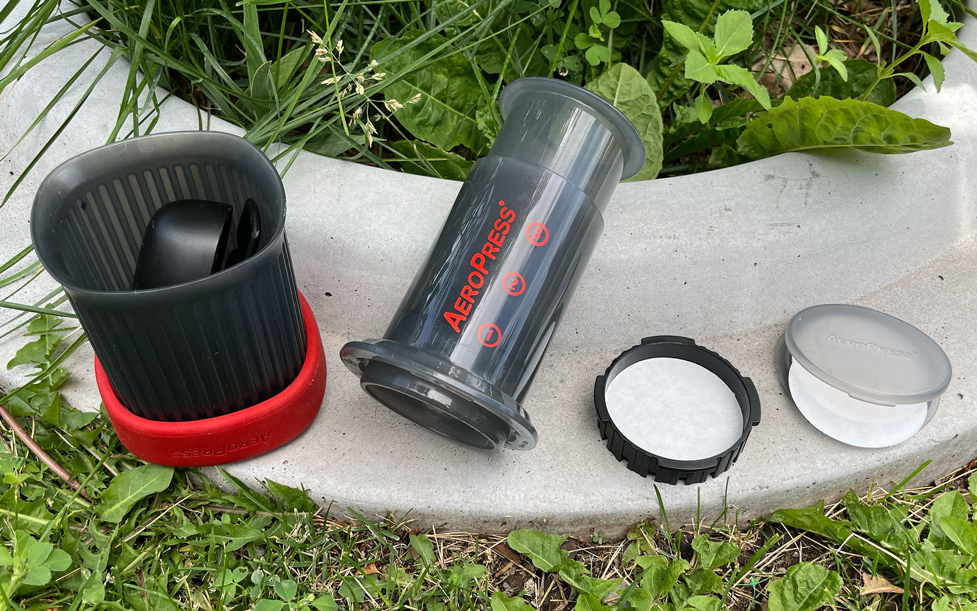 AeroPress includes a ton of compostable filters, but you can place a few in the included carrying container for camping.