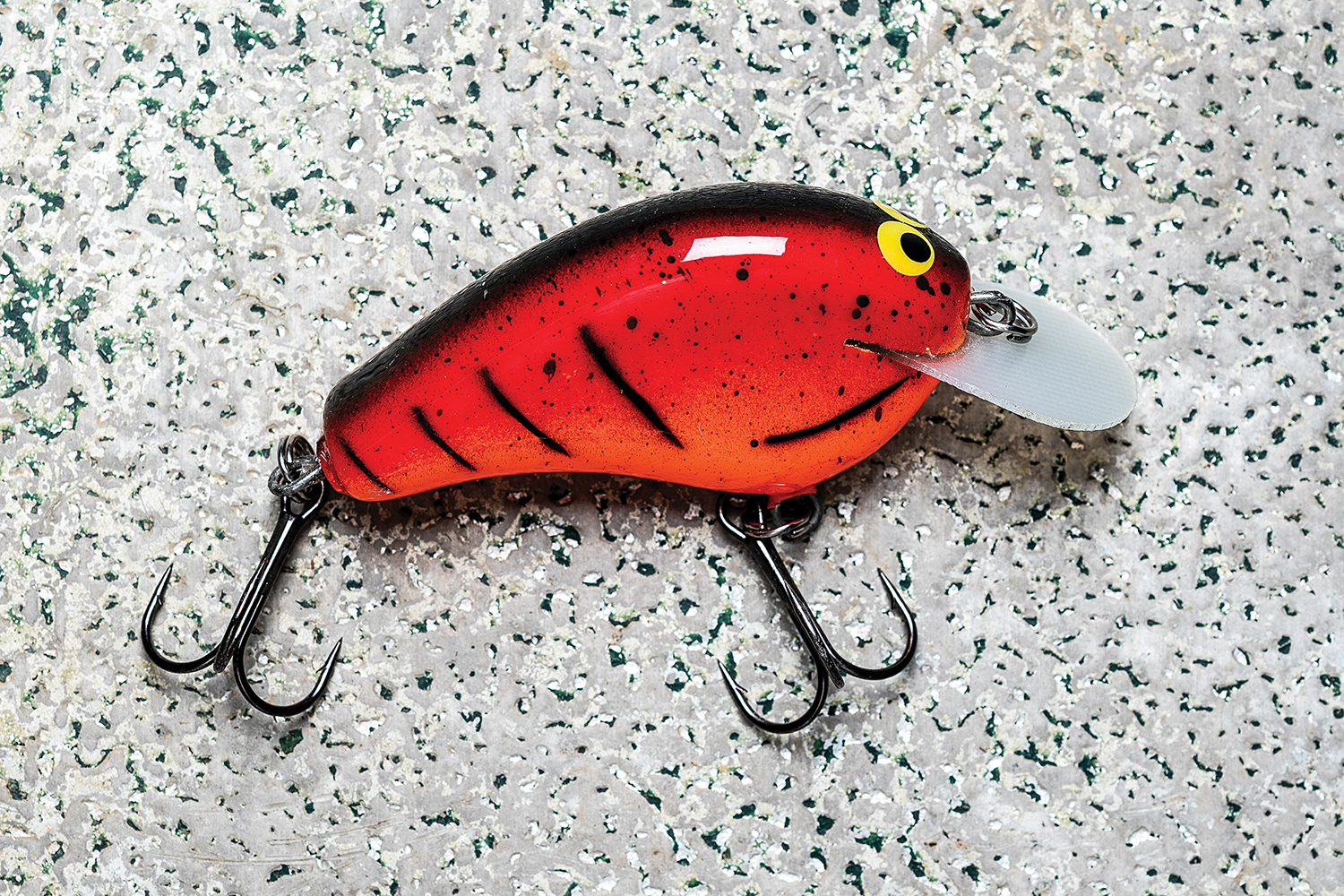 close-up of single, finished red crankbait