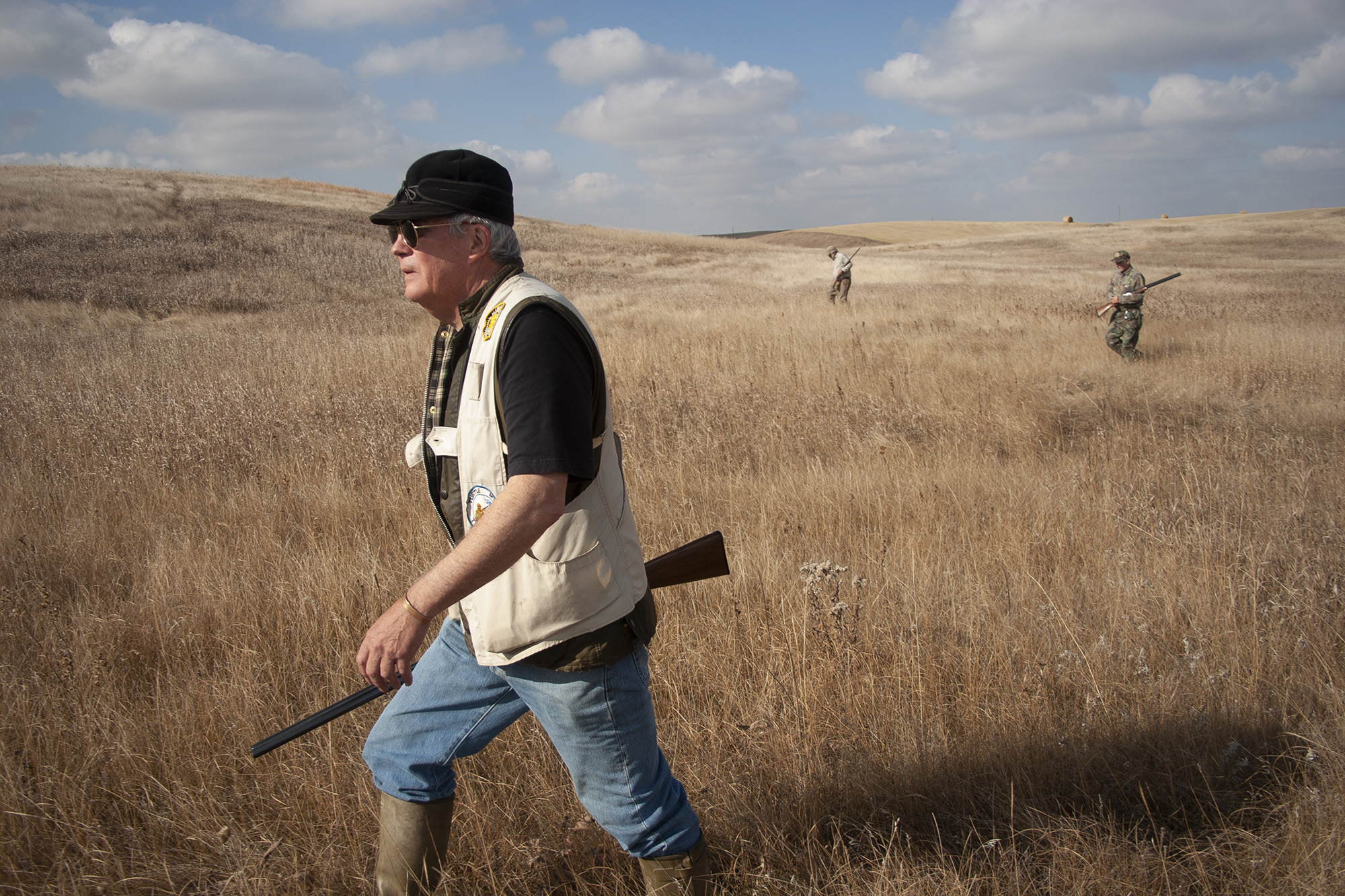 A bird hunter walks across the North Dakota prairie