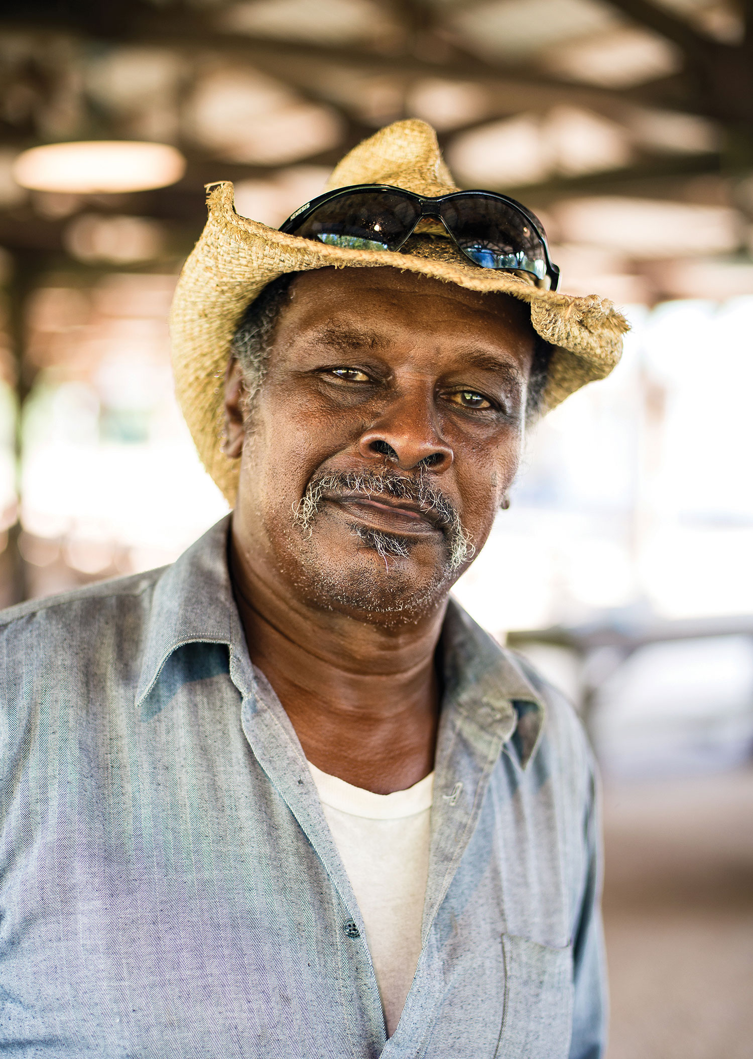 man in straw hat and blue shirt, camp chef portrait