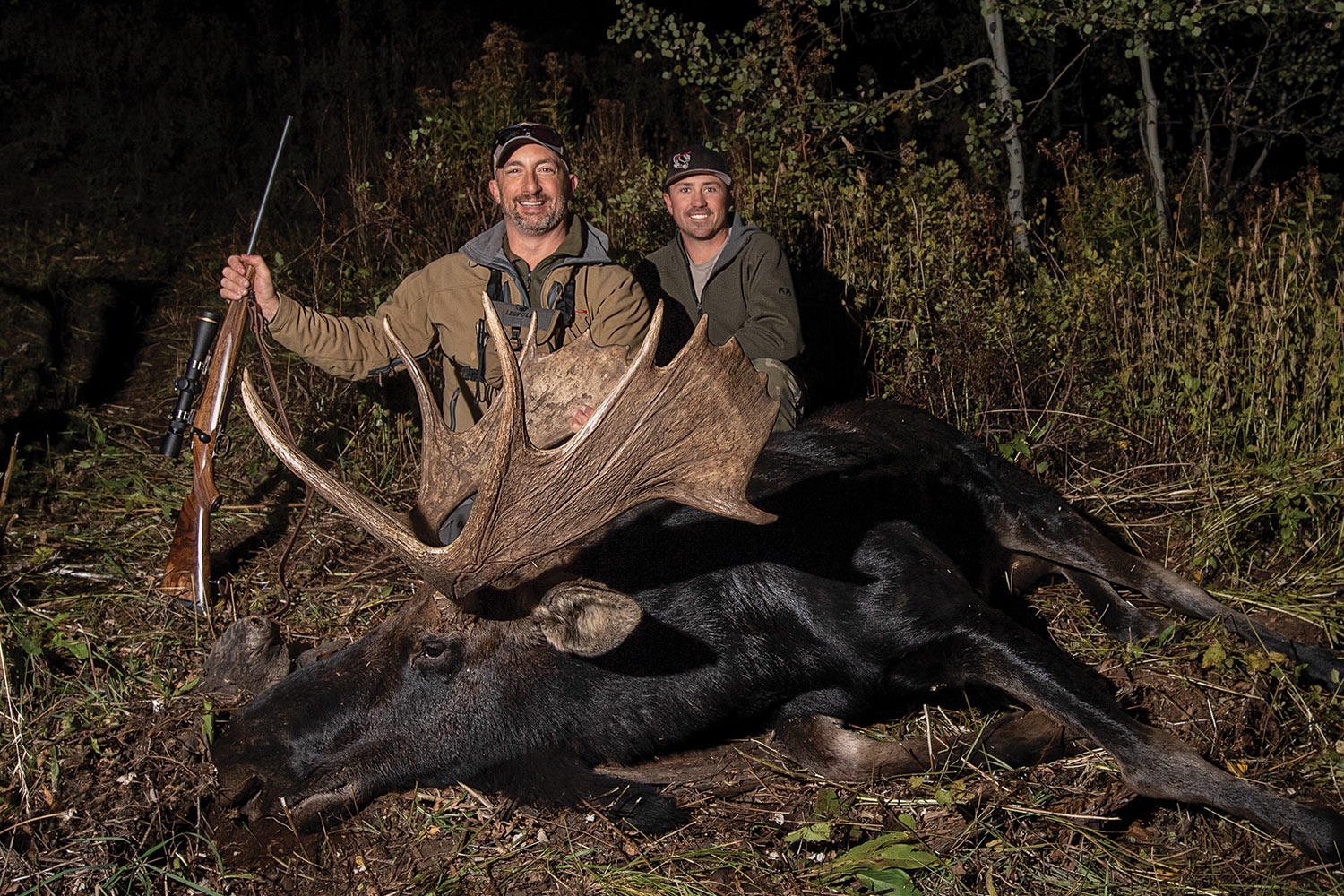 Hunter and guide pose with large moose.