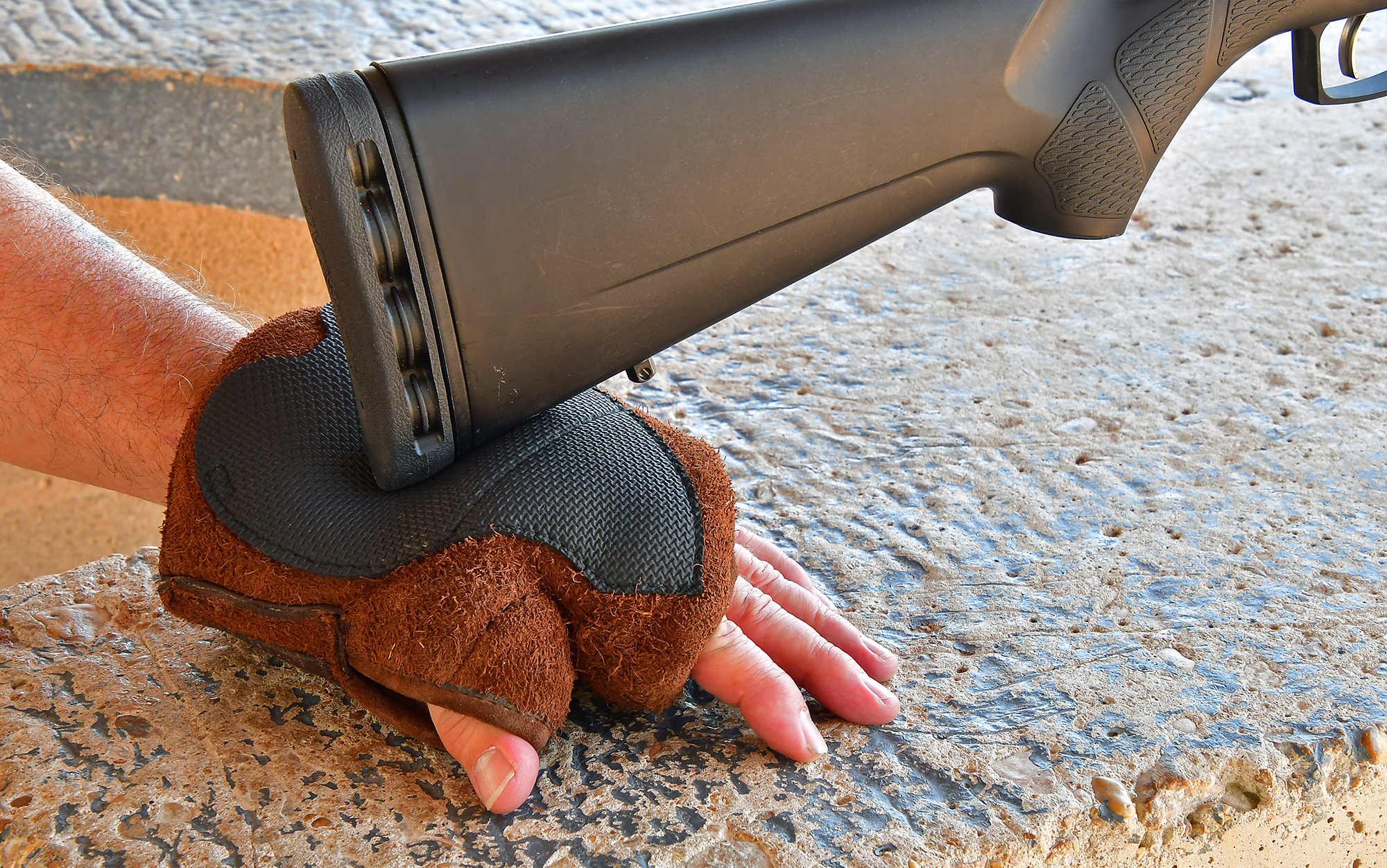 You can shoot from the FTW SAAM Ambidextrous Dog Paw using a fist or flat hand.
