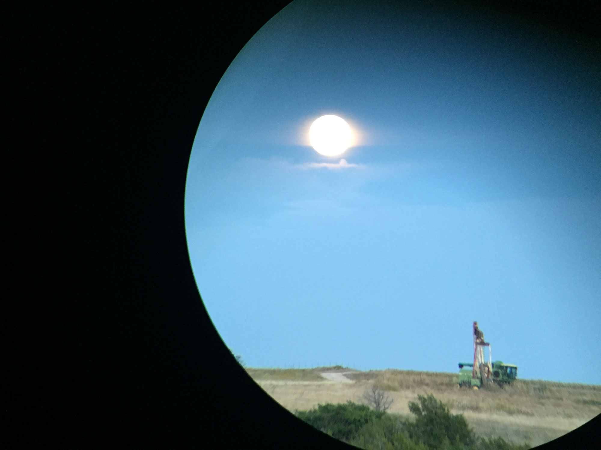 full moon over oil rig