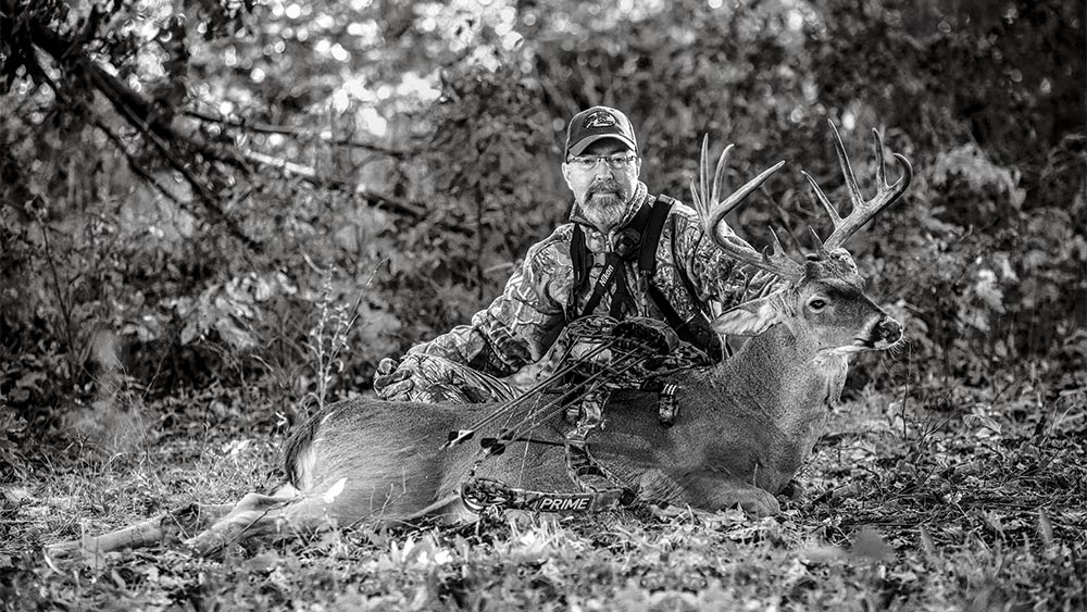 Grant woods with a whitetail buck