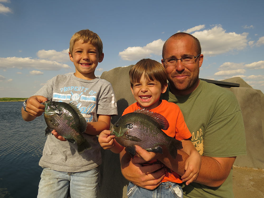 father and sons fishing bluegills