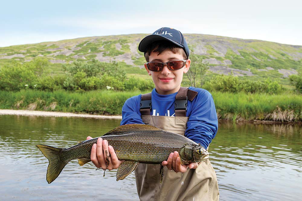 young boy with grayling