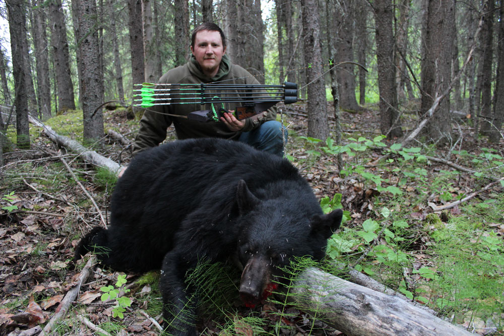 hunter with black bear