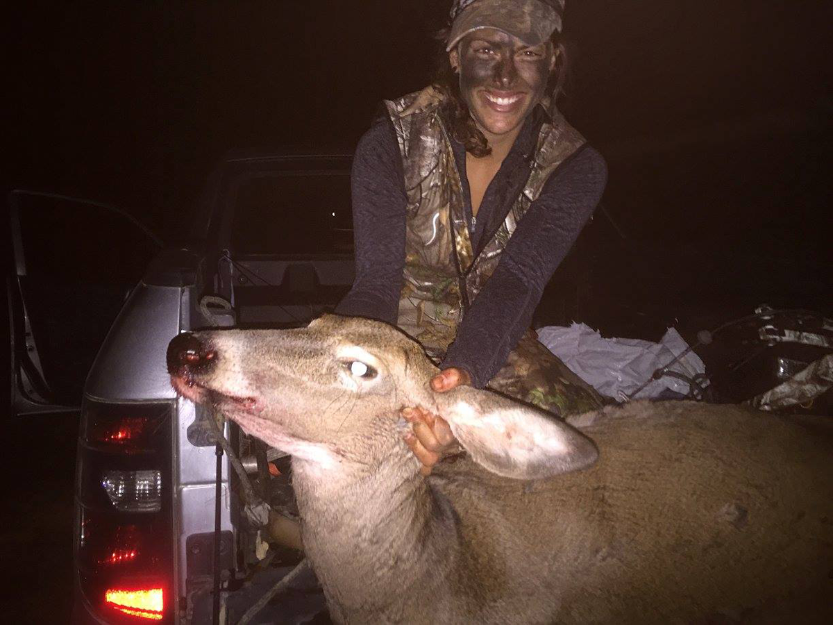 bowhunter with doe