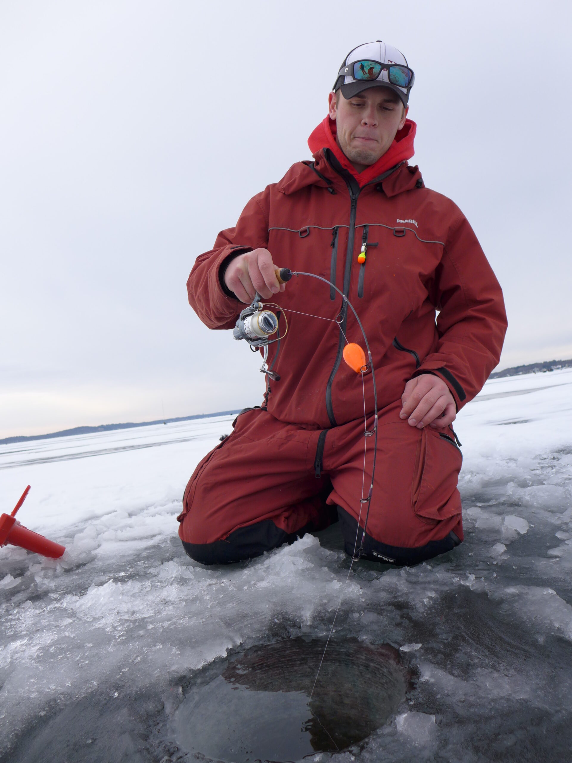 fighting catfish through the ice