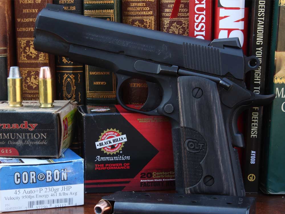 handgun and ammo in front of legal books