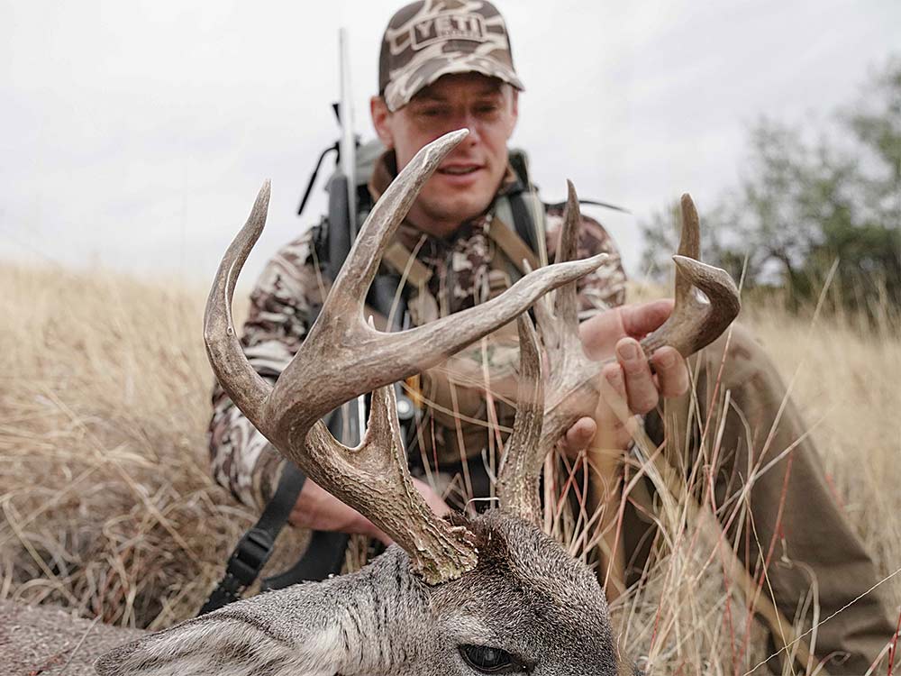 hunter coues deer in the field