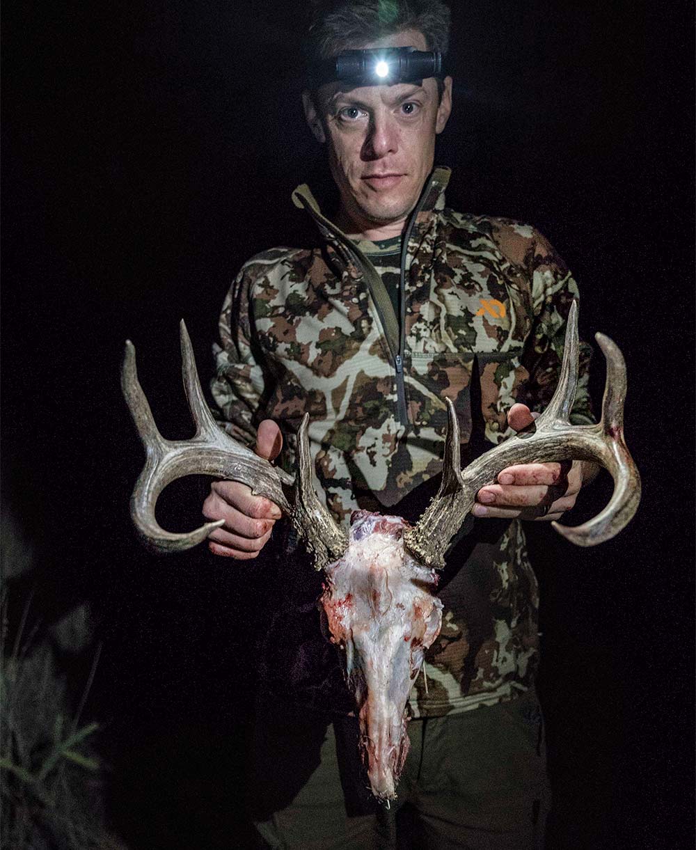 steven rinella holding up coues deer rack