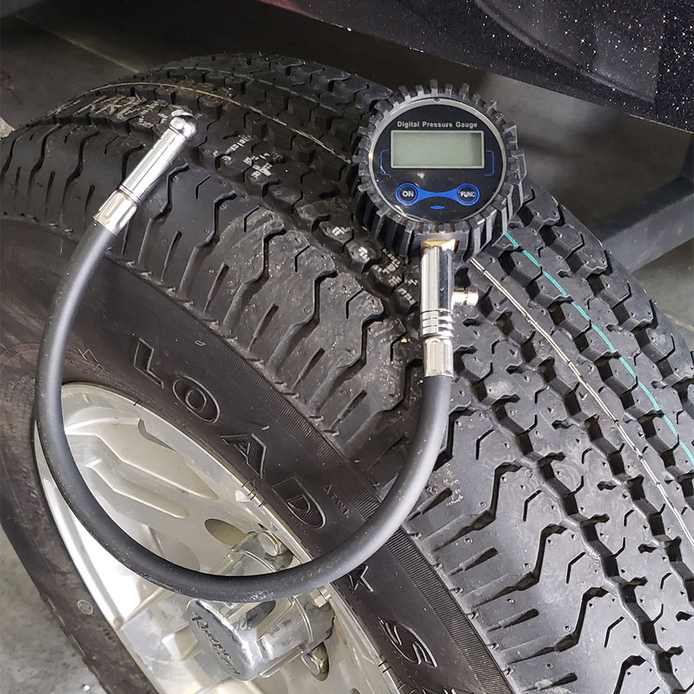 a digital tire gauge on top of a tire