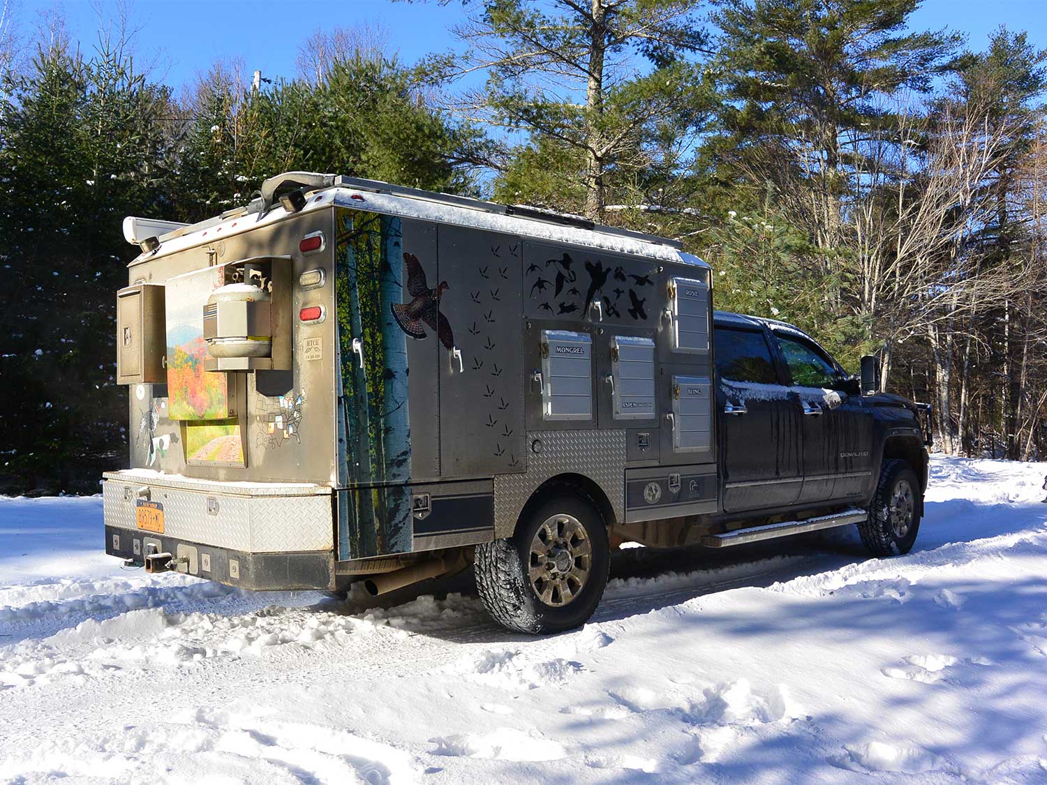 a custom hunting truck in the snow