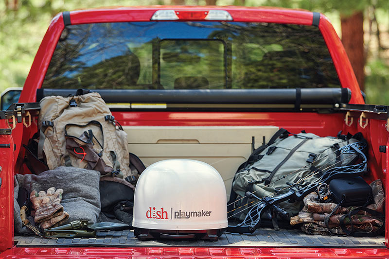 portable dish playmaker in the bed of a red truck