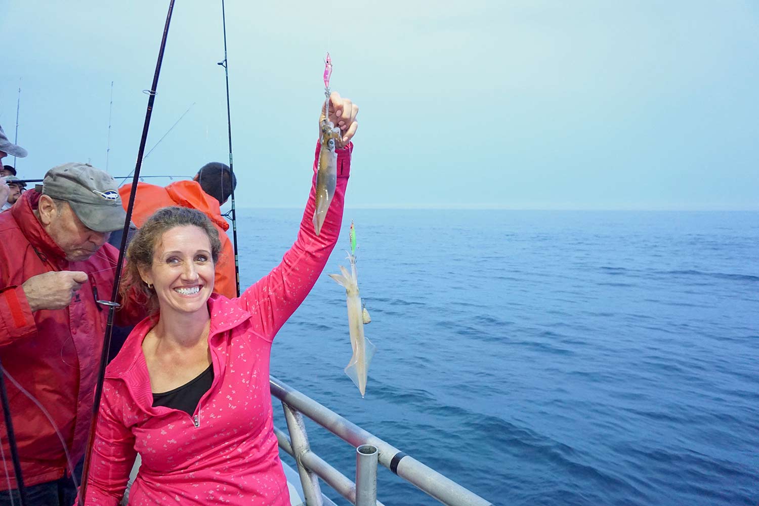 woman holding up a squid