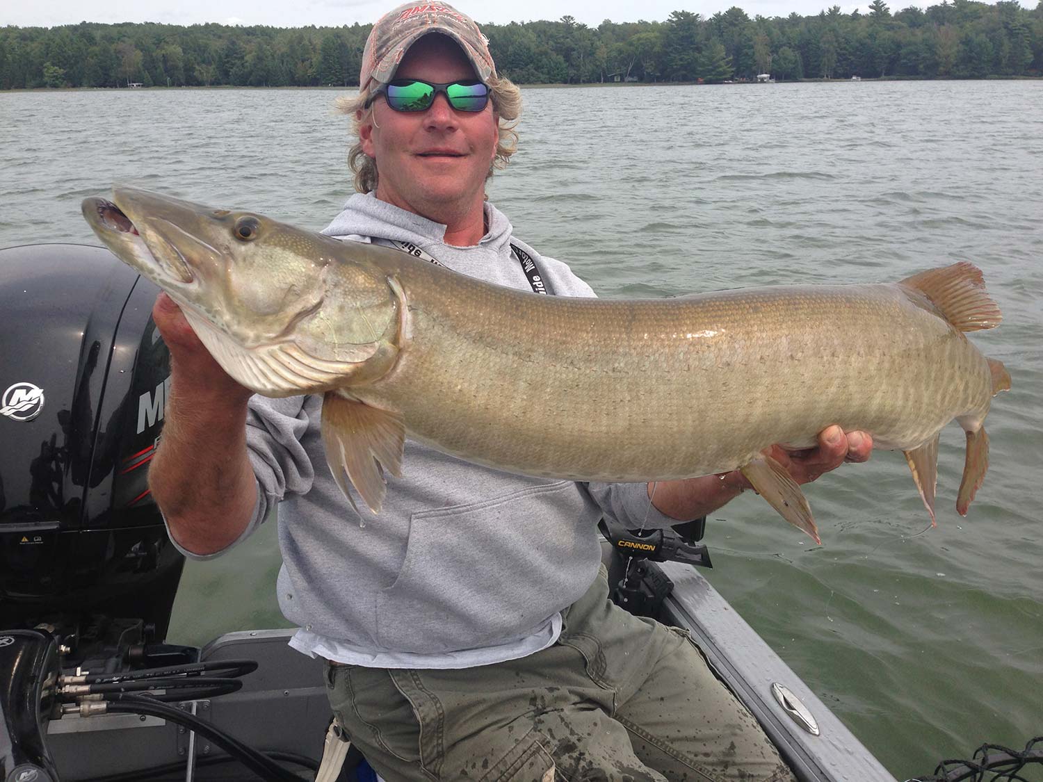 rob manthei holding up a muskie