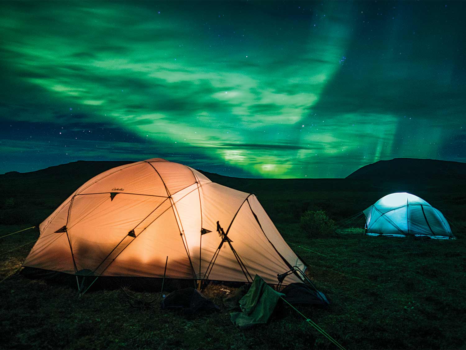 two base camp tents under the alaskan night sky