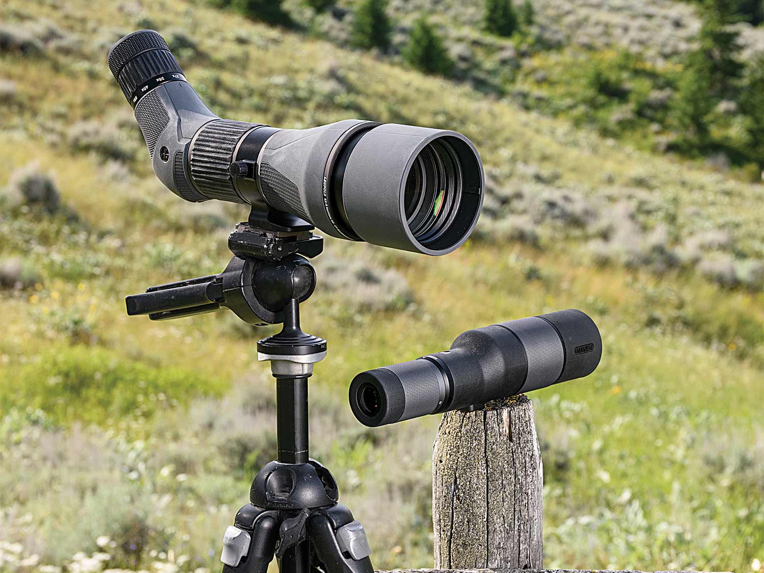 two spotting scopes in a field